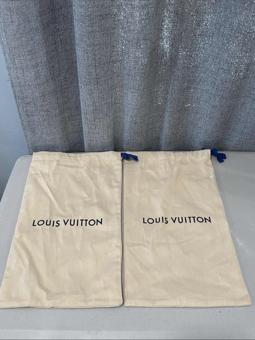Authentic two Louis Vuitton shoe dust bags with drawstring.